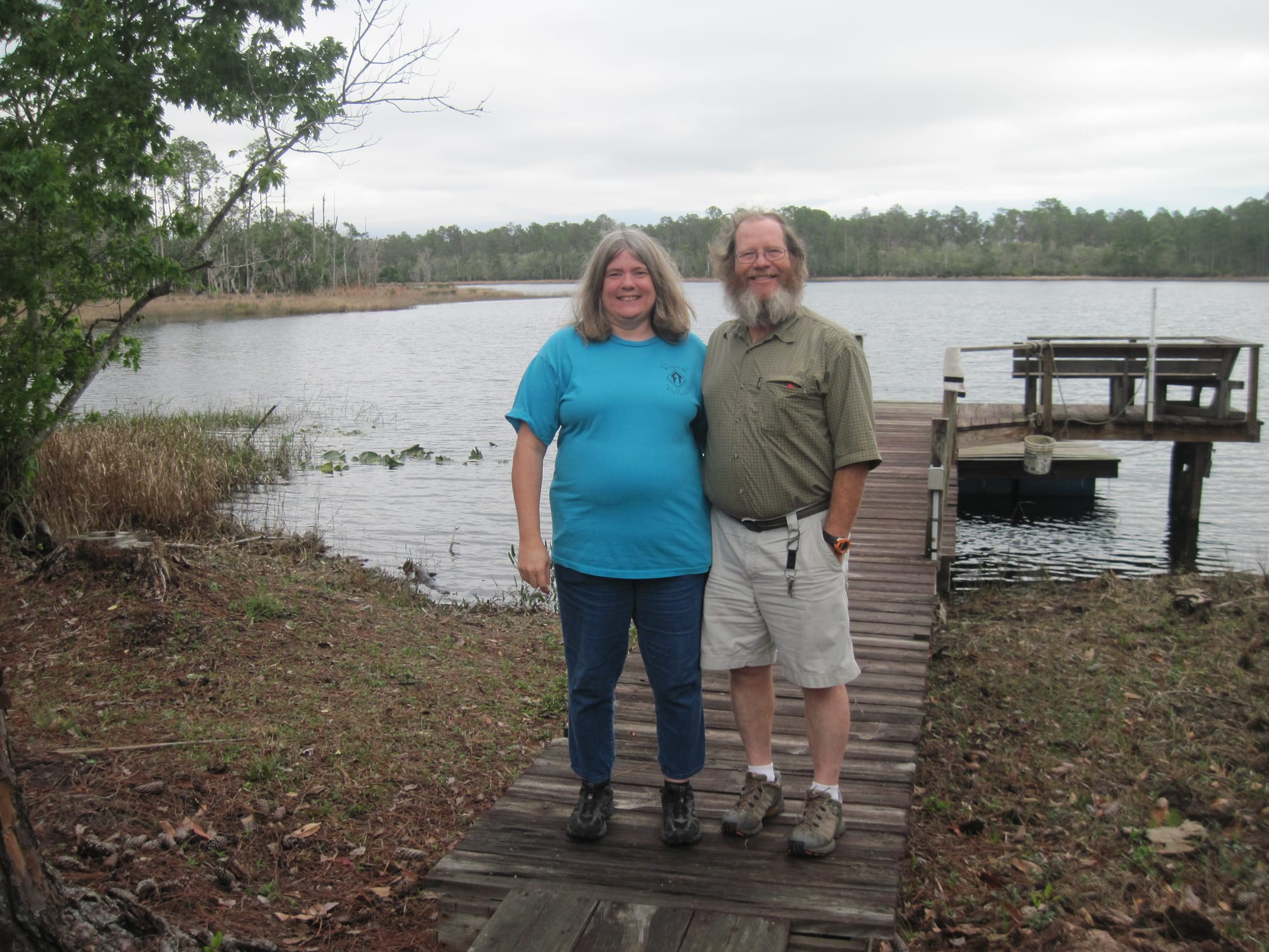 Woman and man standing together on a dock