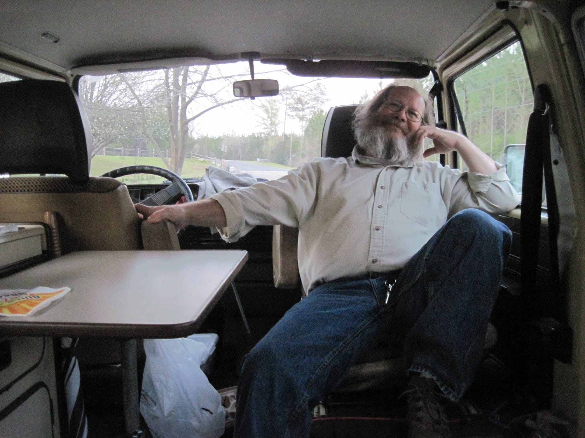 Man relaxing inside a camper van