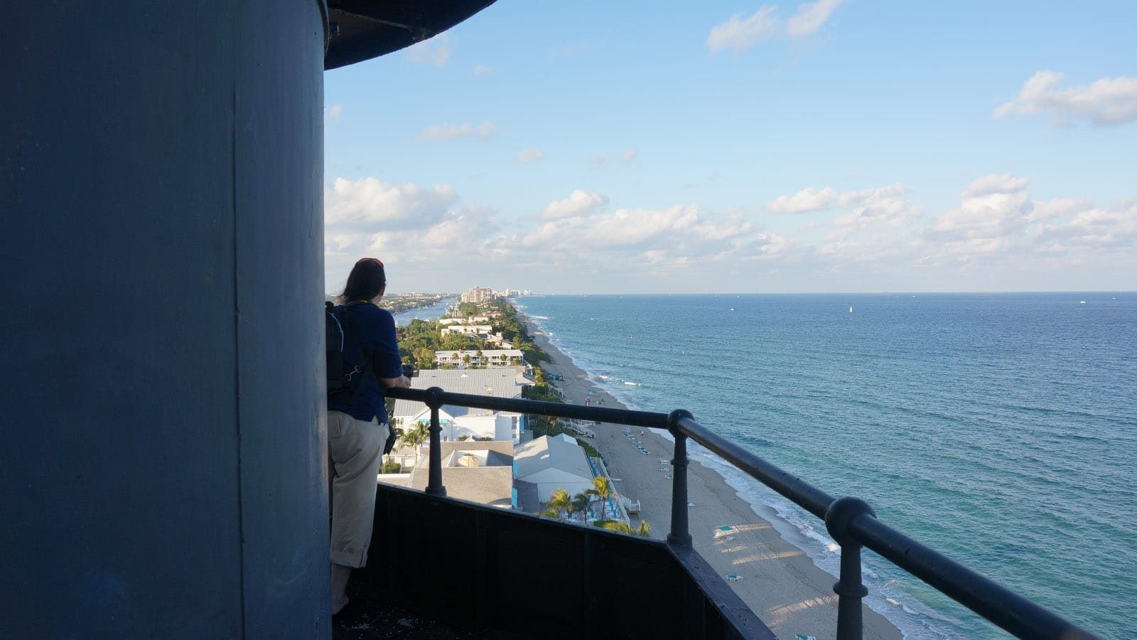 Looking up along a barrier island crowded with low buildings