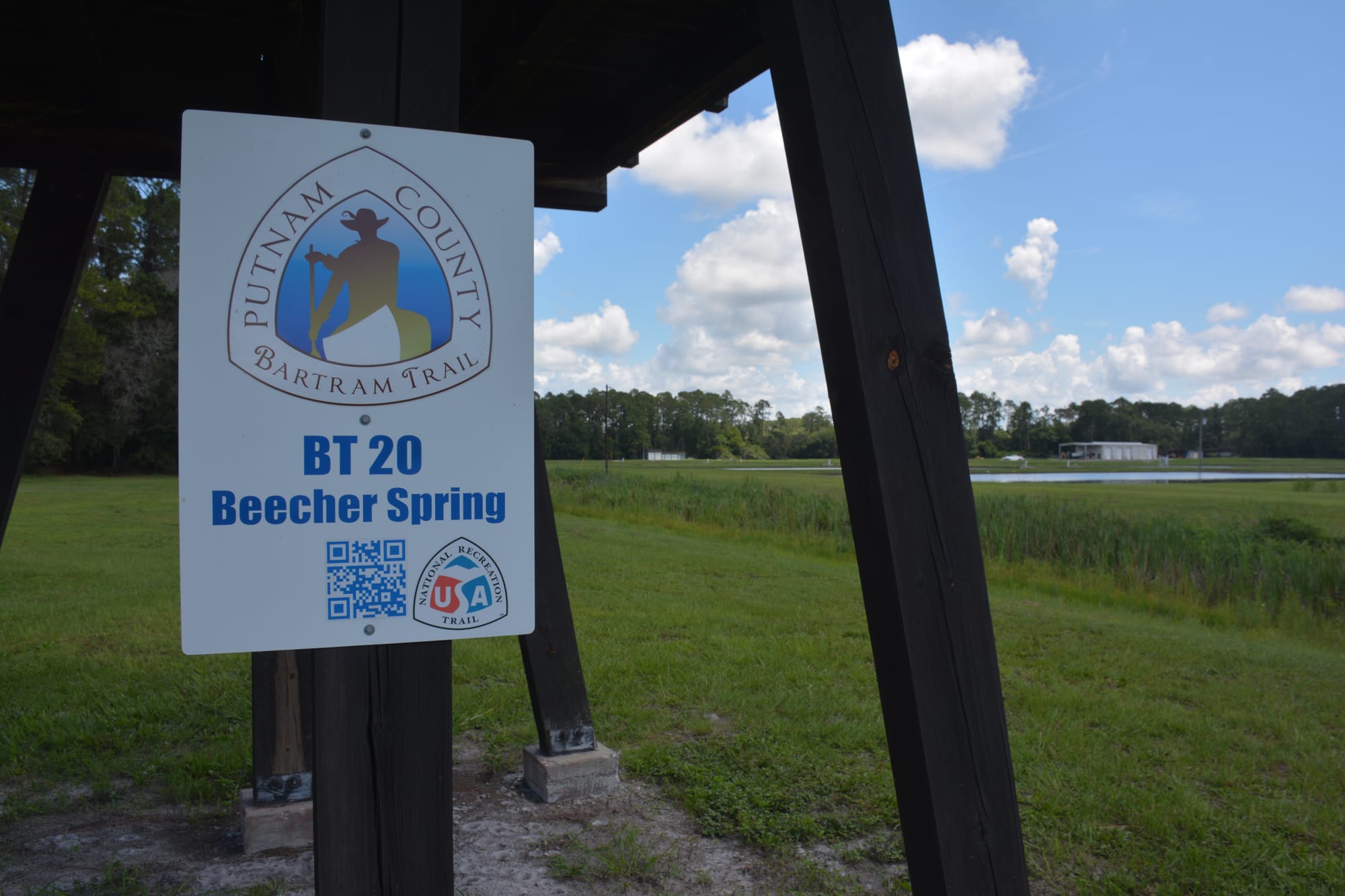 Bartram Trail marker affixed to base of tower at fish hatchery