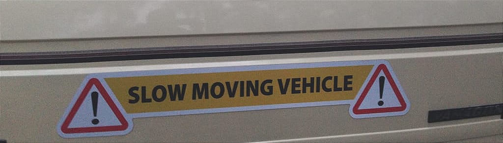 Slow moving vehicle magnet on back of VW camper van