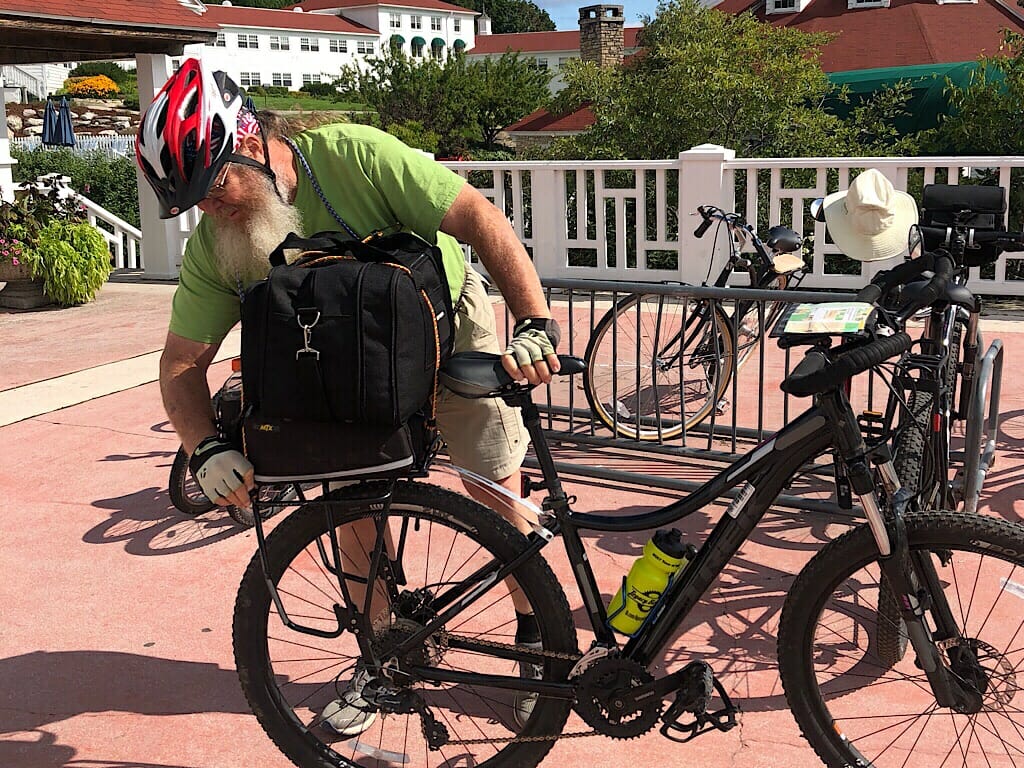 Unstrapping luggage from the bike