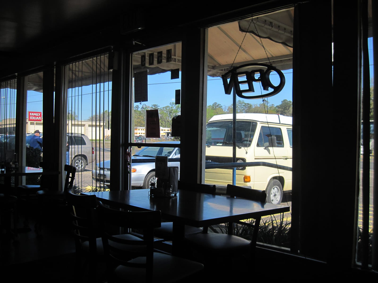 VW camper outside a diner window