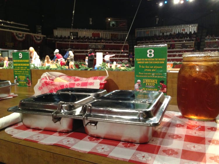 Meal in a tin with sweet tea in an auditorium with rigging