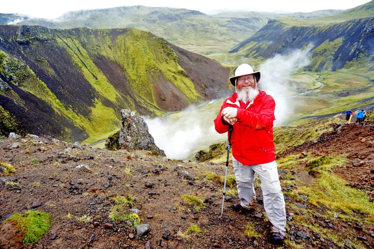 John on the lip of a volcanic caldera steaming and mossy