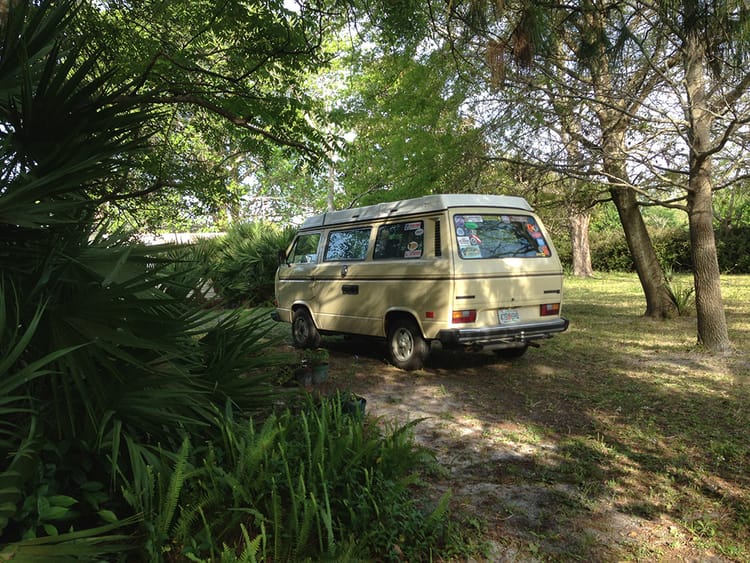 VW Westfalia in a wooded yard