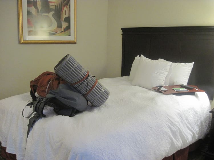 Backpack on a hotel bed