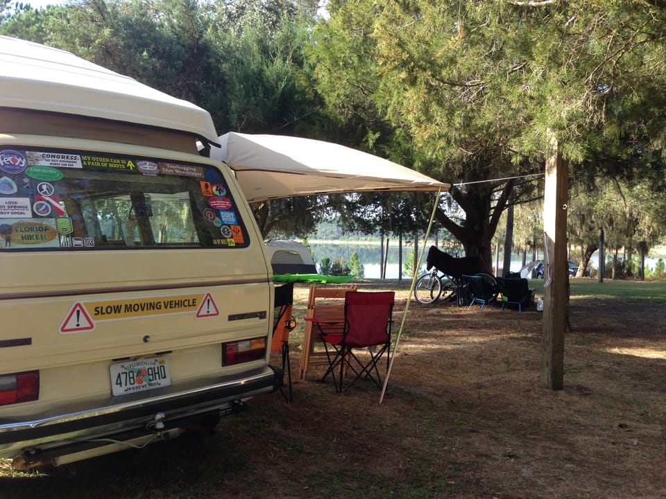 VW Westfalia in a beautiful lakeside group camp among tent campers