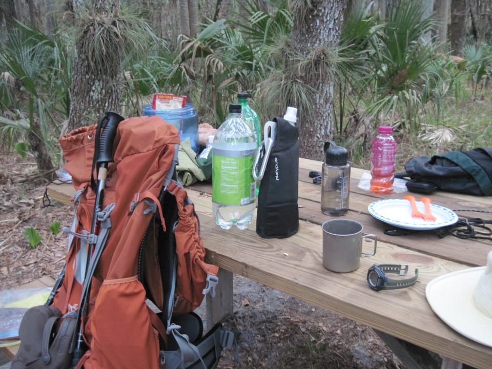 Hiking gear at a picnic table
